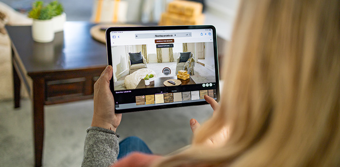 woman browsing flooring options on tablet